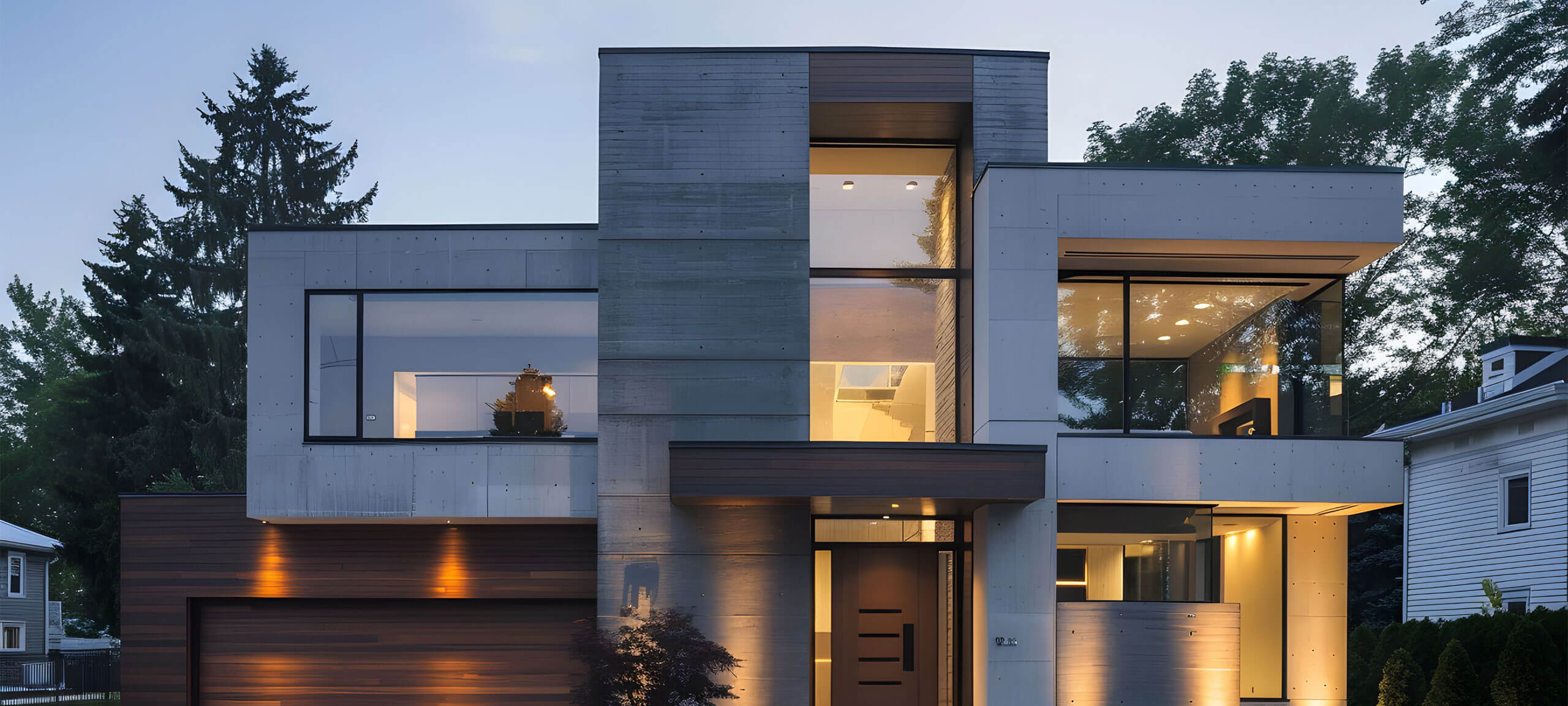 A modern house with large windows and a mix of concrete and wood textures.
